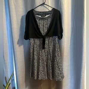 Adorable black with white polka dots with a half black jacket dress.